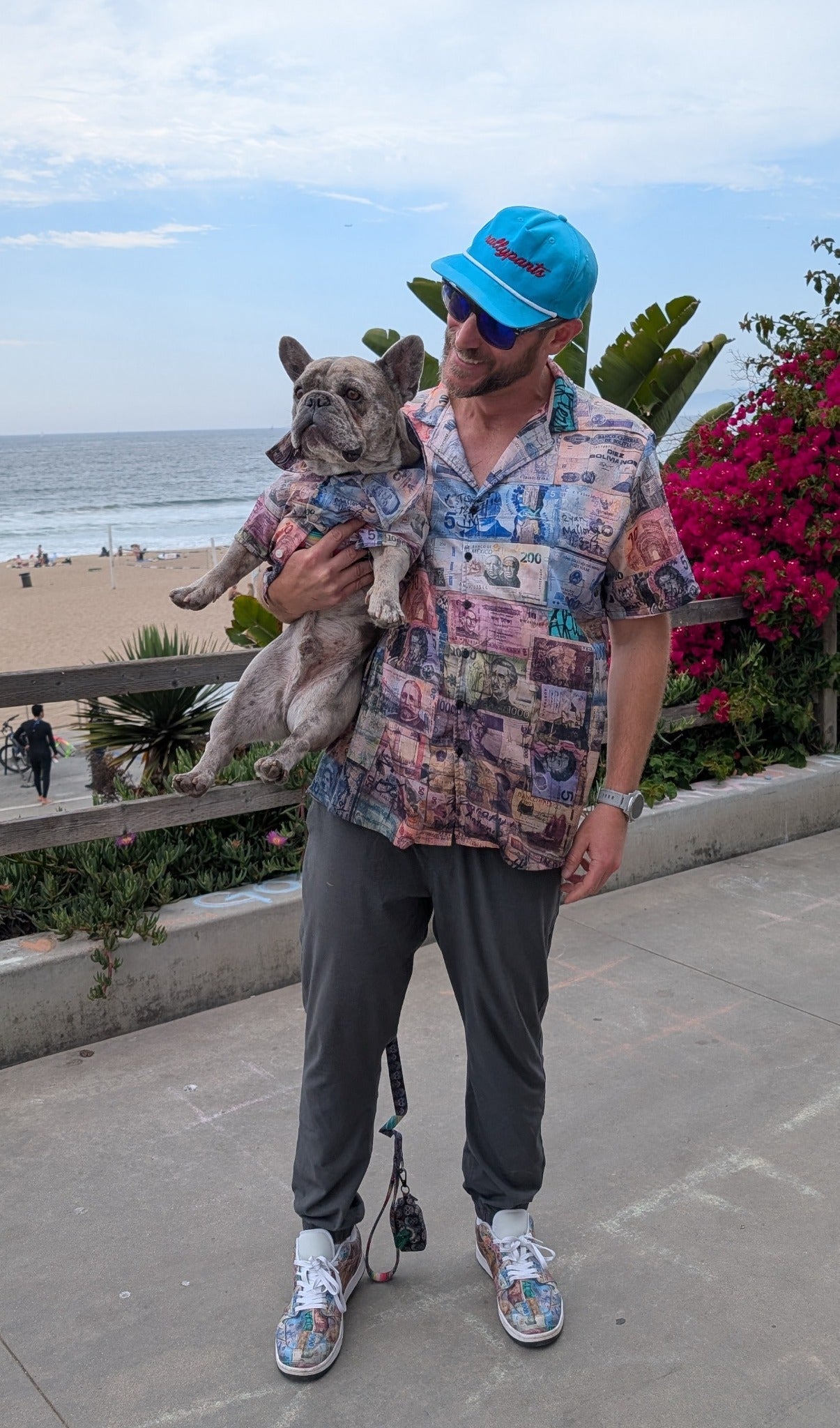 Efectivo Verde Pesto Ink rallypants shirt with matching dog fit near the beach