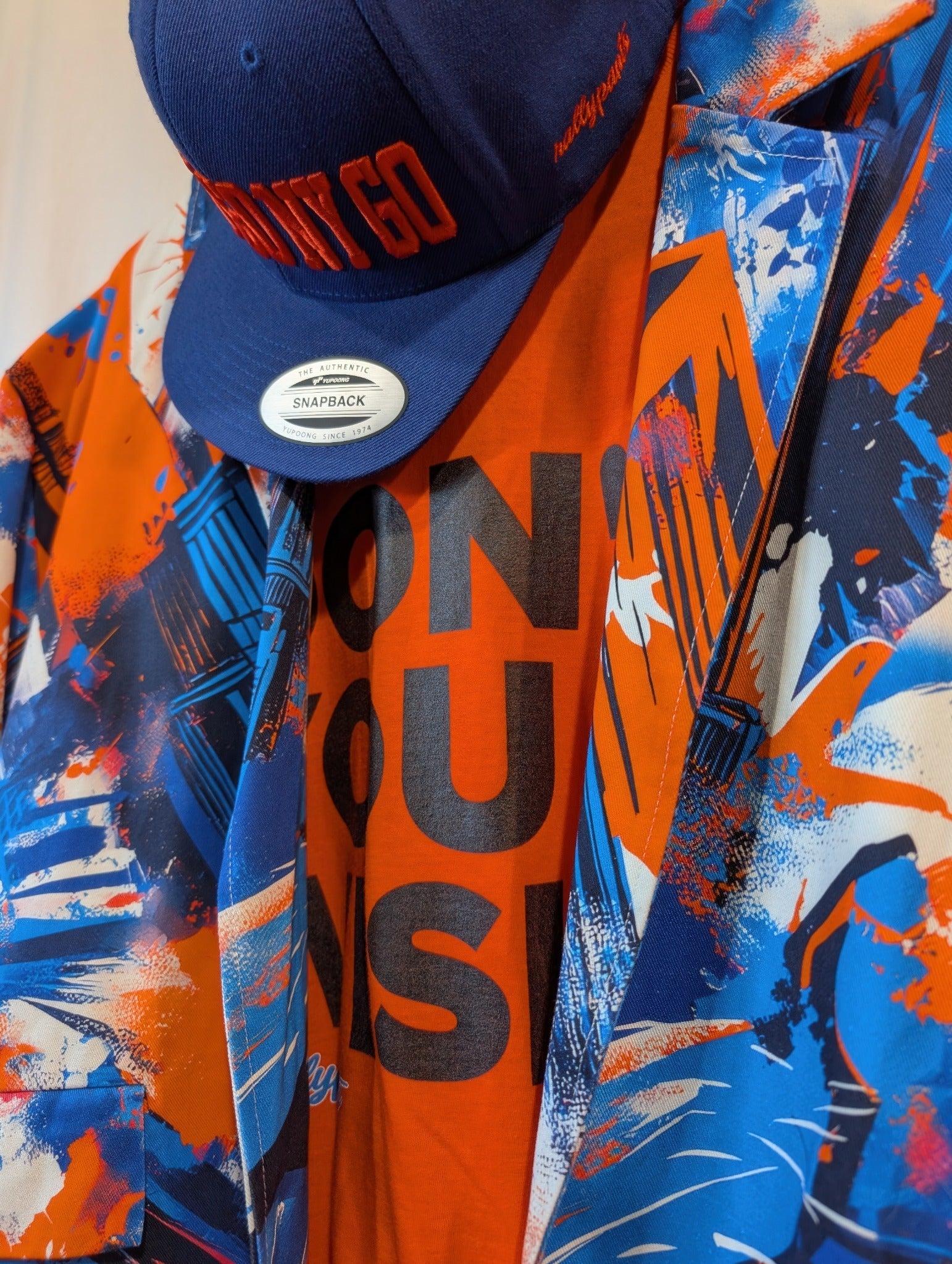 rallypants nyc orange blue graffiti triple threat full fit campaign image